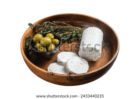 Soft Goat cheese chevre in a plate with thyme and olives. Isolated on white background. Top view