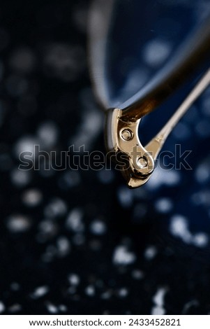 Highly detailed pictures of a glasses screws shot with a macro lens.