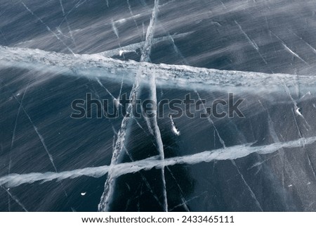 Ice of Lake Baikal, the deepest and largest freshwater lake by volume in the world, located in southern Siberia, Russia Royalty-Free Stock Photo #2433465111