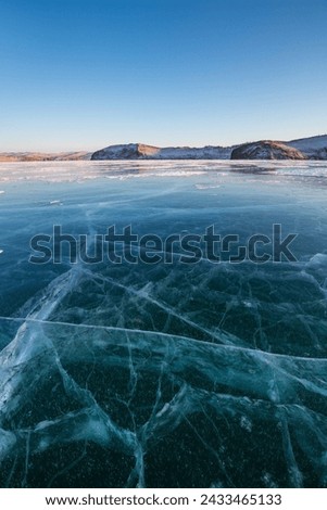 Ice of Lake Baikal, the deepest and largest freshwater lake by volume in the world, located in southern Siberia, Russia Royalty-Free Stock Photo #2433465133