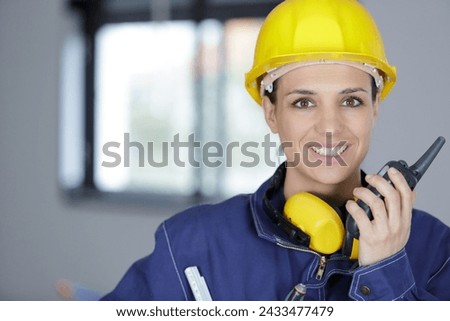 young smiling woman with yellow helmet