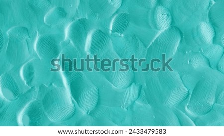 Aquamarine colored plasticine texture. Playdough textured background. Abstract light blue clay backdrop. Templates of web banner, handmade poster design or label design elements. Natural 3d relief.