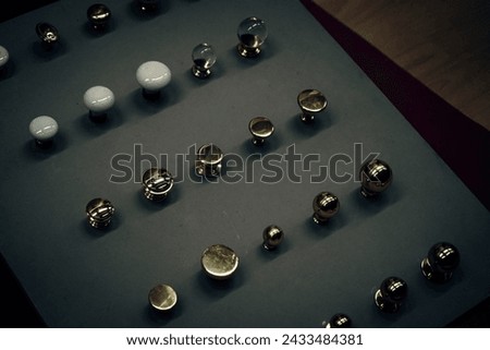 Various door knobs for choosing cabinet doors for interior decoration in dark night light.