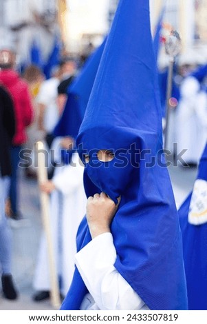 Lovely image of a little penitent during Holy Week in Andalusia.