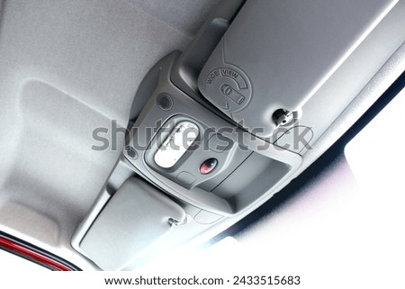 Ceiling of a modern car. Car headliner. Sun visor auto. Royalty-Free Stock Photo #2433515683