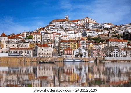 A picturesque panorama of Coimbra with the reflection in the Mondego river Royalty-Free Stock Photo #2433525139