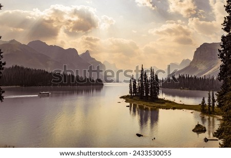 Beautiful Maligne Lake with Spirit Island and Boat in Jasper National Park, Alberta, Canada Royalty-Free Stock Photo #2433530055