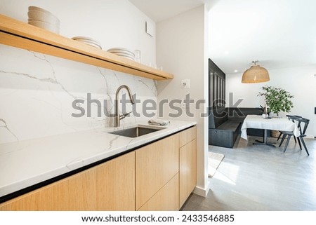 Dining room interior with table and chairs table settings staged with dinnerware flowers large windows bright and spacious home interior photography