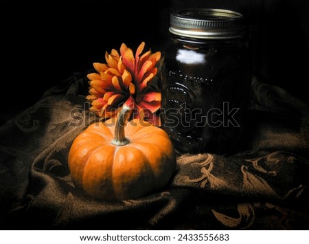 fall pumpkin with flower and jam