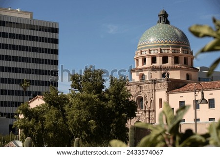 Afternoon light sines on the Pima County Historic Courthouse and downtown skyline of Tucson, Arizona, USA. Royalty-Free Stock Photo #2433574067