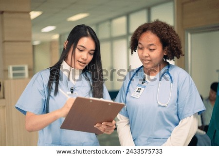 Nurse student Multi-ethnic group of happy nursing students talking medical university corridor.	 Royalty-Free Stock Photo #2433575733