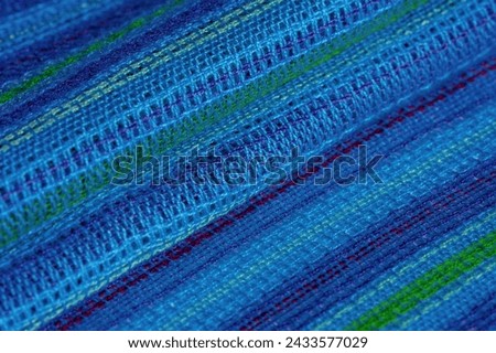Fabric blue-turquoise striped blue-green lines, very light elastic jersey, light sheen. texture background, pattern postcard Royalty-Free Stock Photo #2433577029