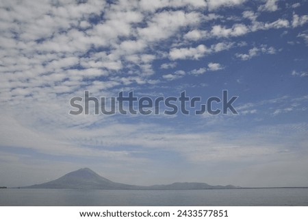 mountains, sea and blue sky are irreplaceable beauty Royalty-Free Stock Photo #2433577851