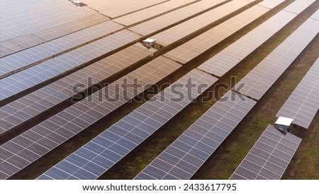 A picture showcasing a vast, contemporary photovoltaic solar farm.