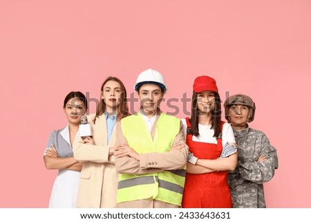 Women of different professions on pink background Royalty-Free Stock Photo #2433643631