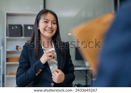 Business woman offer cost of hundred dollars. Hands close up Venality, bribes, fraud concept hand give money - United States dollars, hand get paid by businessman. Royalty-Free Stock Photo #2433645267
