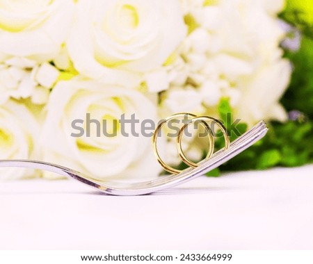 The image is of a pair of glasses placed on a table. Tags: rose, floral design, cut flowers, flower arranging, flower, floristry, garden roses, artificial flower, jewelry, bouquet, plant.