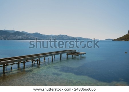 Long exposure photography of pier on the sea. Yalikavak Bay view in Bodrum Peninsula of Turkey