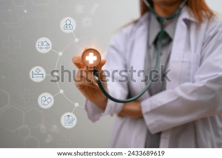 Hand of a doctor a stethoscope with modern medical icons. Health insurance concept
