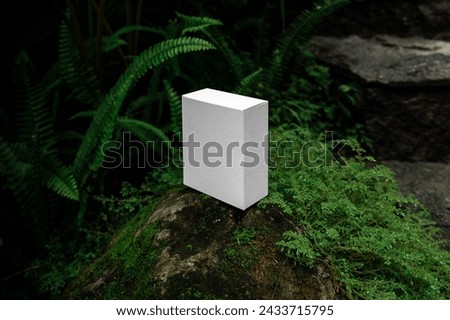 Box packaging branding mockup template, real photo, set amidst the lush backdrop of tropical nature environment. Blank isolated object to place your design. 