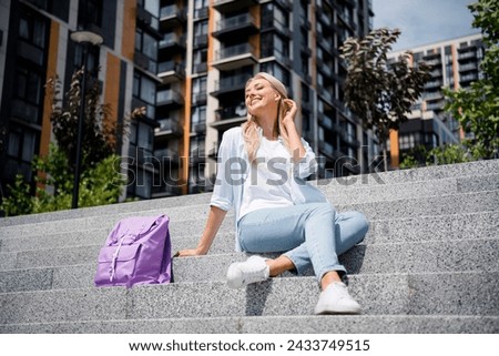 Photo of dreamy adorable cute girl spending weekend sunny day alone modern big town outdoors