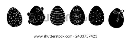 Set of vector flat black ornamental easter eggs with hearts, stains, bows. Holiday hand drawn monochrome illustrations, clip art for greeting cards, festive design