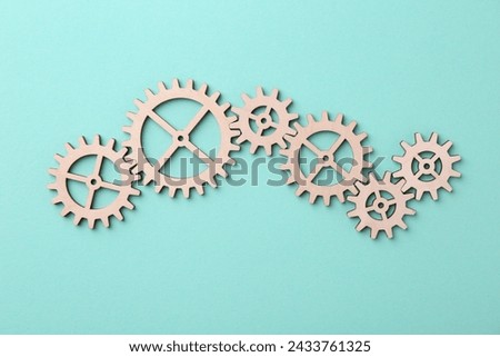 Business process organization and optimization. Scheme with wooden figures on turquoise background, top view Royalty-Free Stock Photo #2433761325