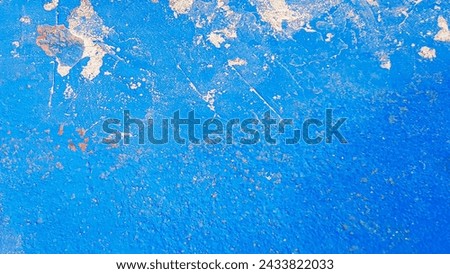 Texture of blue shabby wall with uneven surface and lack of paint in some places. A banner with space for text. High quality photo