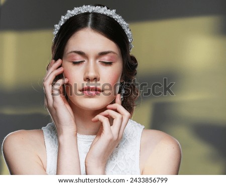 Beautiful Bride Portrait wedding makeup hairstyle, gorgeous young woman with closed eyes in white dress. Close up picture.