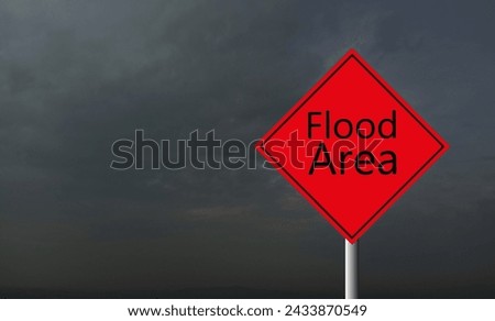 red Warning Flood Area Highway Road Sign, Red, Yellow Warning Highway Sign with words Flood Area with stormy sky background