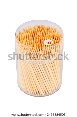 Wooden toothpicks in box, isolated on a white background Royalty-Free Stock Photo #2433884505