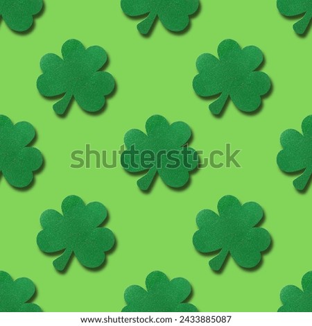 Seamless pattern for St. Patrick's day with clover leaf on green background.
