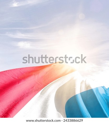 Luxembourg waving flag in beautiful sunlight.