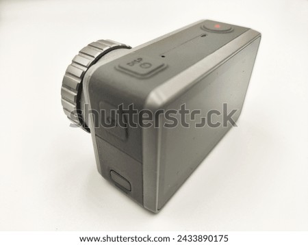 Dynamic Action Camera Isolated on White Background: Essential Gear for Adventure Photography and Videography