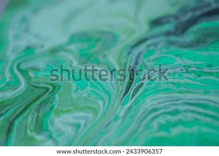 Beautiful fluid art natural luxury painting. Marbleized effect. Ancient oriental drawing technique. Teal, green, blue and turquoise colors. Abstract decorative marble texture.  Royalty-Free Stock Photo #2433906357