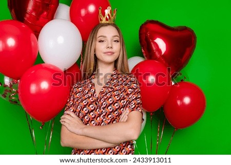 Portrait of gorgeous perky girl dressed print blouse arms crossed golden crown celebrate birthday isolated on green color background