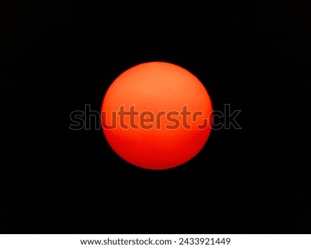 Capturing the sun's brilliance, this photo radiates warmth and golden tones. A celestial dance of light and shadows unfolds, embodying the sun's beauty. Royalty-Free Stock Photo #2433921449