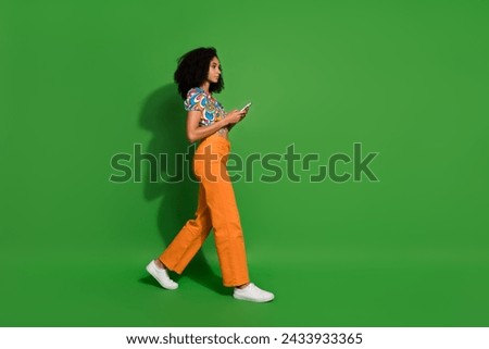 Side profile photo of blogging young woman with smartphone look mockup for sources explore smm isolated over green color background