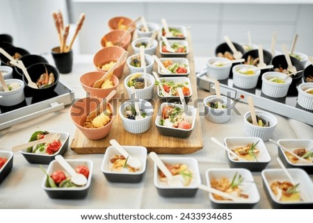 Delicious Delights: Gourmet Small Dishes of Savory Food for Office Party, Close-up Buffet Spread for New Business Launch Celebration Event in 4K Ultra HD