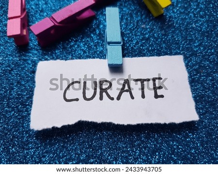 Curate writting on blue background.