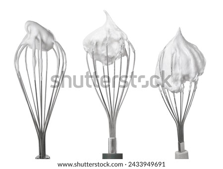 Many different whisks with cream isolated on white, collection Royalty-Free Stock Photo #2433949691