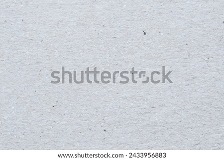 Craft paper texture, a sheet of gray recycled cardboard texture as background