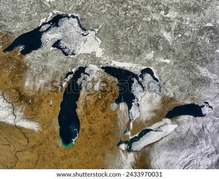 Ice on the Great Lakes true color. Ice on the Great Lakes true color. Elements of this image furnished by NASA. Royalty-Free Stock Photo #2433970031