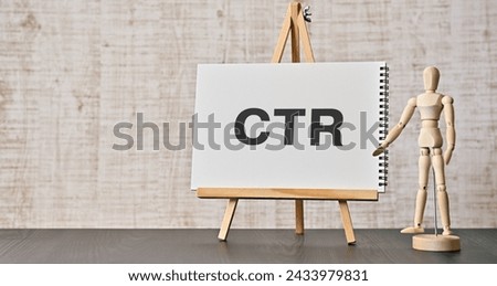There is notebook with the word CTR. It is an abbreviation for Click Through Rate as eye-catching image.