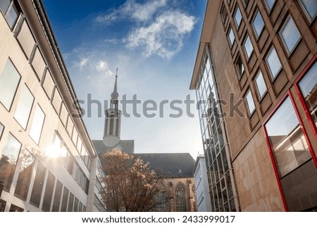 Street of Dortmund with the Propstein kirche, or Sankt Johannes Baptist Kirche church in the center of the city. Saint Johann Baptist church is a catholic church. Royalty-Free Stock Photo #2433999017