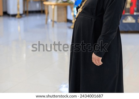 Priest in the church. Background with selective focus and copy space for text