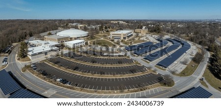 Aerial view of Community College of Baltimore County Catonsville with solar panel covered parking lots, wellness athletic center, continuing education, social science hall, admissions office