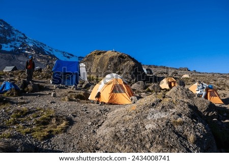 Karanga Camp: A Haven Amidst the Rugged Terrains of Mt. Kilimanjaro Royalty-Free Stock Photo #2434008741