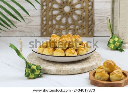 Kue Nastar or Pineapple tart cookies, Indonesian popular cookies during lebaran or hari raya, Eid al fitr and Eid al Adha. Ramadan Islamic theme for text and background. Royalty-Free Stock Photo #2434019873