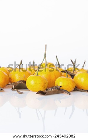 ripe orange with leaves isolated on white